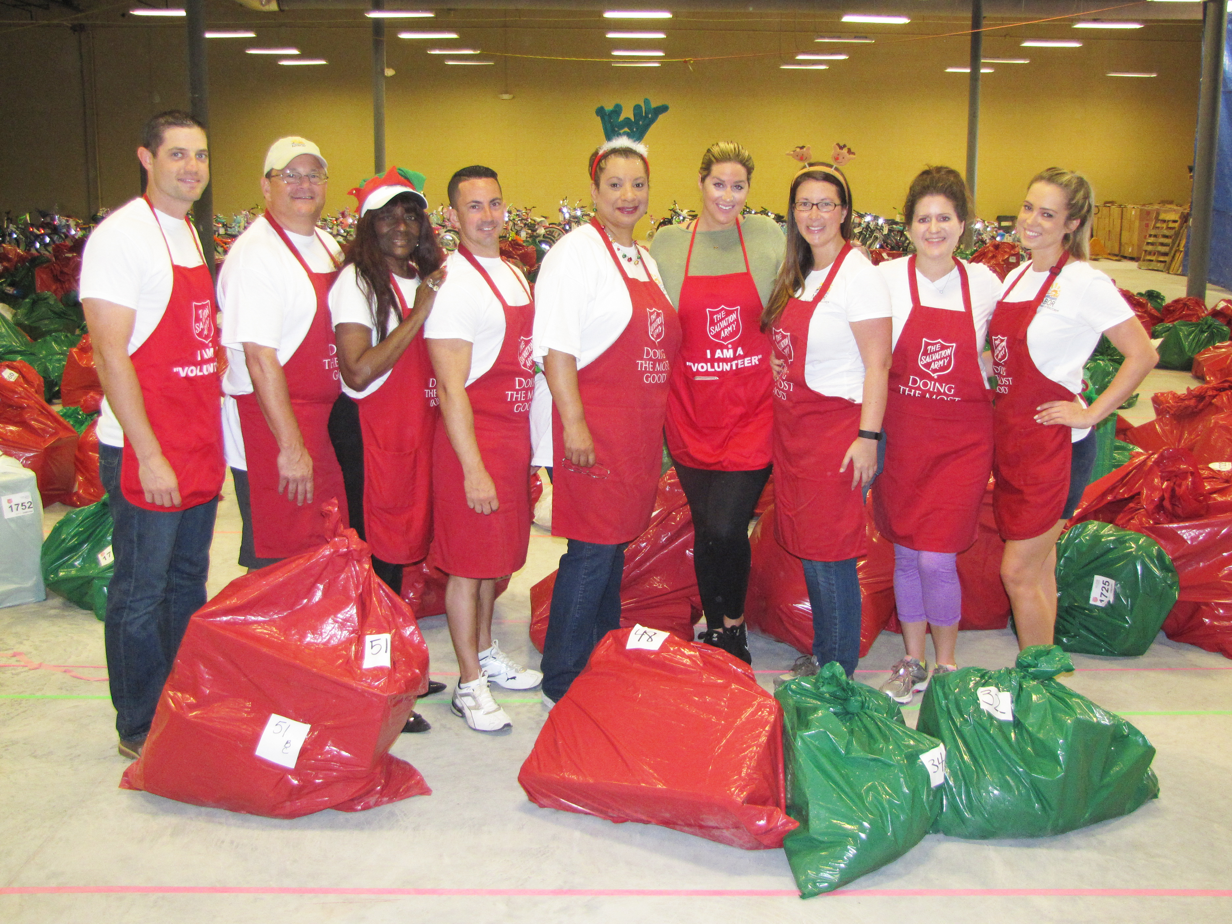 The Salvation Army standing in front of the collection for Toys for Tots